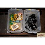 Two boxes containing fishing reels and tackle
