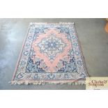 An approximate 5'11" x 4' floral patterned rug