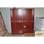 A pair mahogany effect open fronted bookcases (one