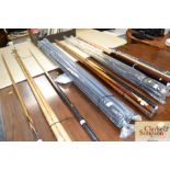 A bundle of five as new snooker cues and tube case