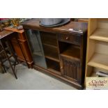 An Old Charm style side cabinet with linen fold de