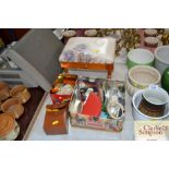 A small upholstered stool; a tin of various sewing