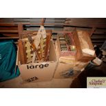 Two boxes containing vintage fishing rods; riding