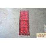 An approximate 2'9" x 1' Mori Jaldar rug