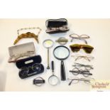 Various vintage magnifying glasses, spectacles etc