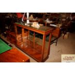 An oak and glass display cabinet