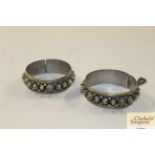 A pair of Indian white metal bracelets