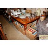 A Victorian walnut extending dining table with ext