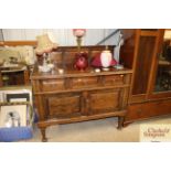 A 1930's oak sideboard