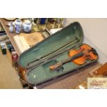 A violin and bow in fitted case