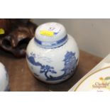 A Chinese blue and white ginger jar decorated land
