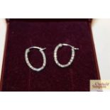 A pair of 9ct white gold ear-rings