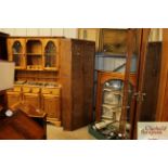 A 1930's oak corner wardrobe