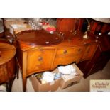 A mahogany serpentine fronted sideboard