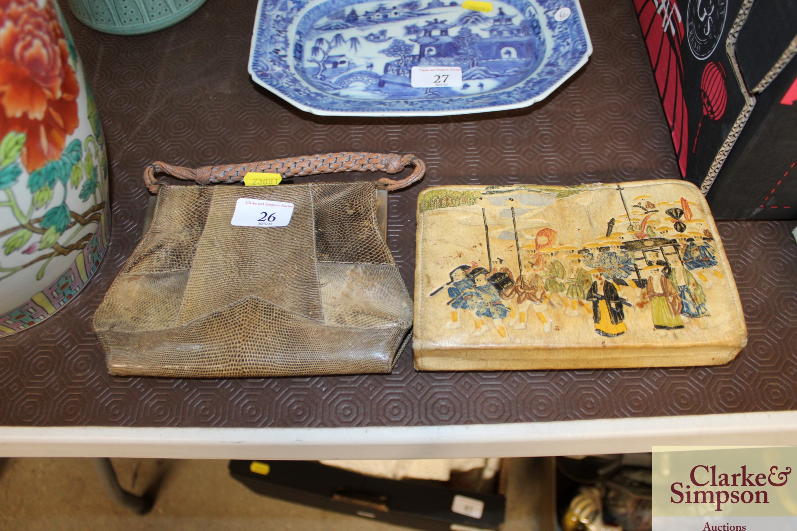 A snake skin purse and one other with Oriental dec