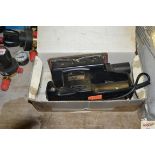 A Black and Decker electric sander