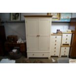 A modern two door wardrobe fitted single drawer be