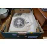 A box containing various black and white prints et