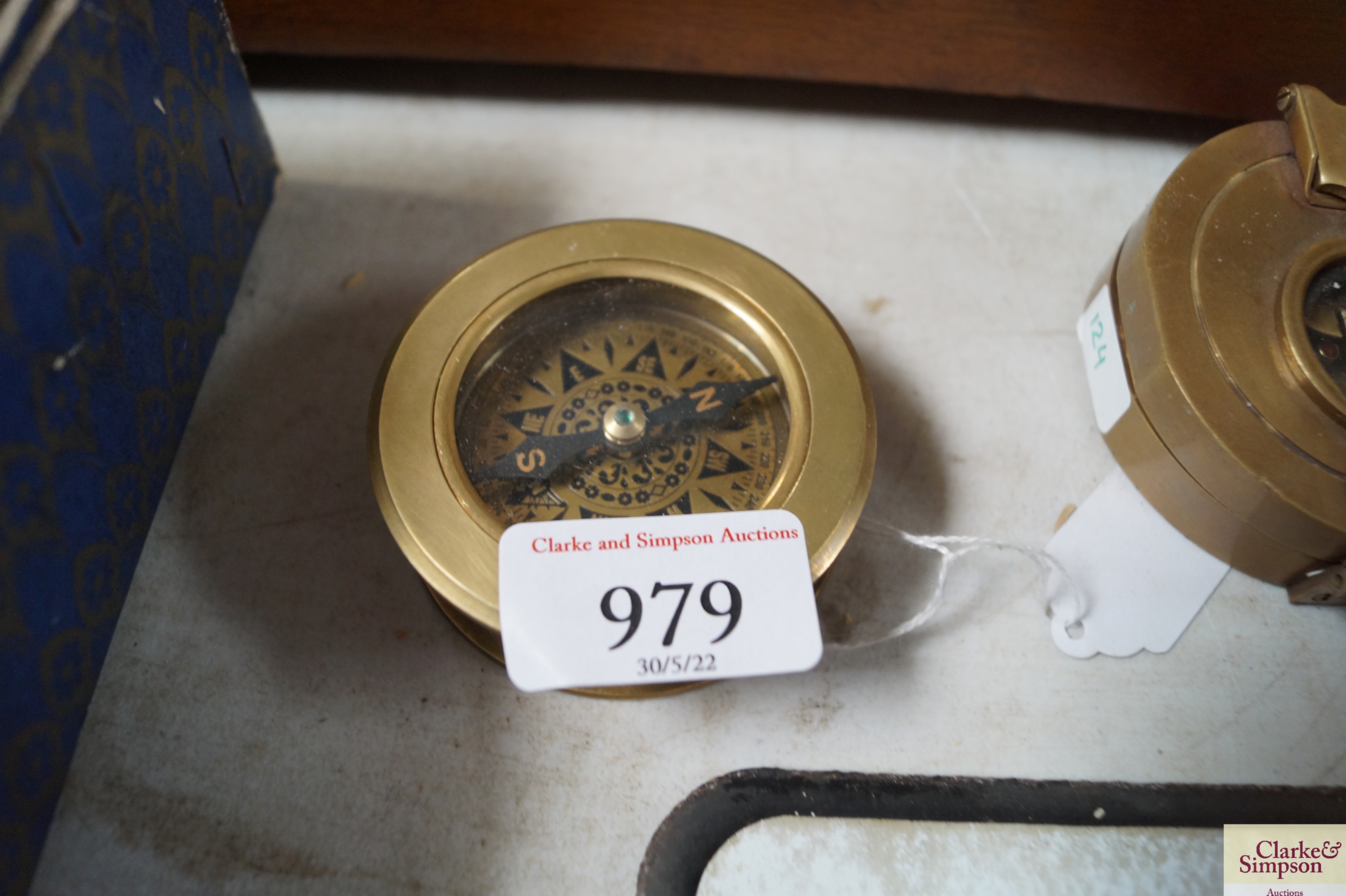 A reproduction brass compass