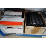 A box of various folders and paperwork holders