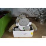 A box containing three PG chimp advertising teddys