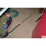 An Abu Garcia Phazer boat rod with bag