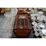 An oak cased two hole wall clock