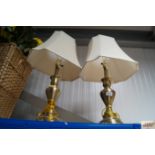 A pair of modern brass table lamps and matching sh