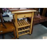 A beech kitchen trolley fitted single drawer