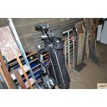 A golf bag; trolley and clubs