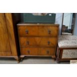 A walnut veneered chest fitted three drawers raise