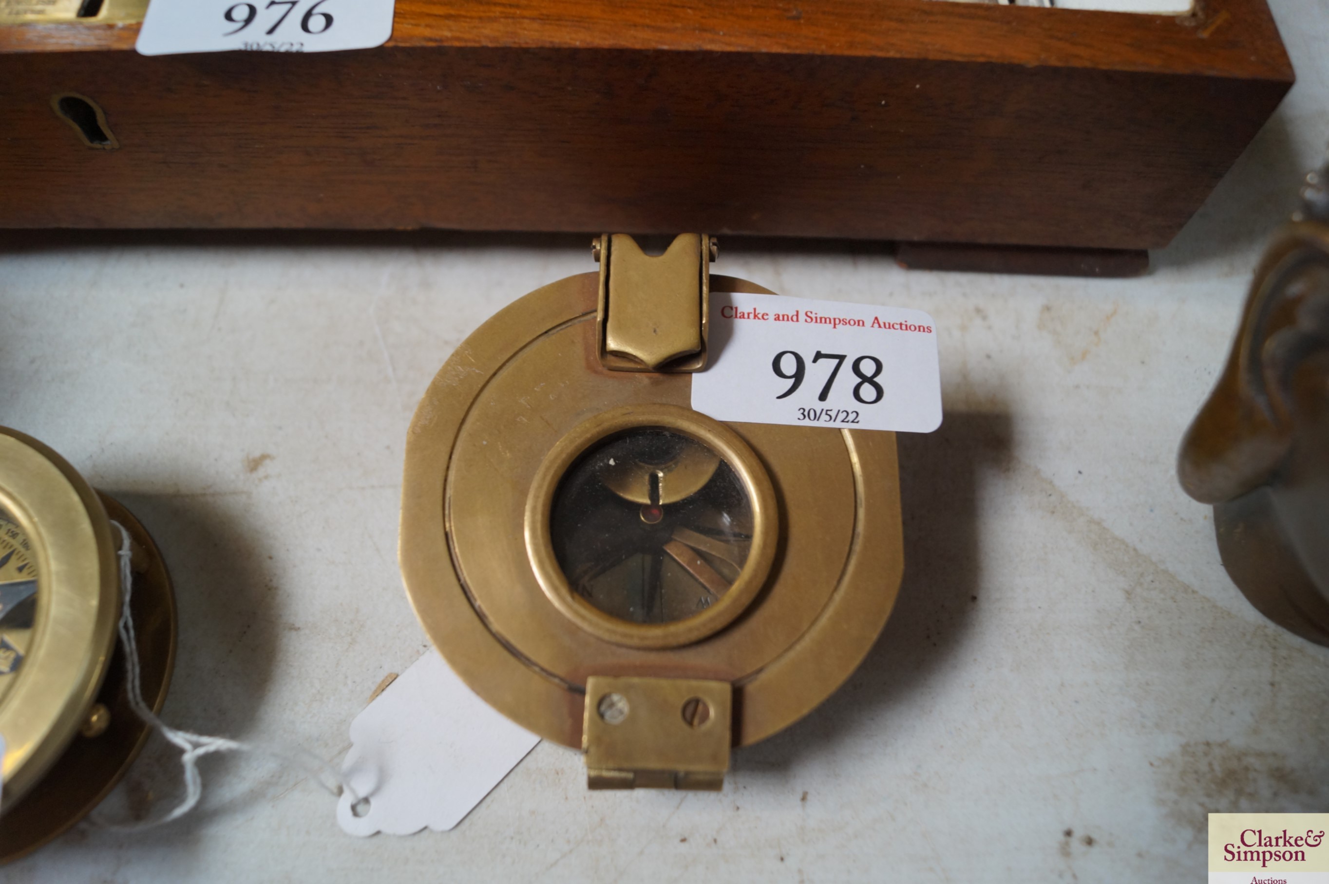 A reproduction brass compass