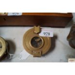 A reproduction brass compass