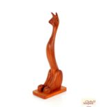 An abstract carved wooden animal figure, 62cm high