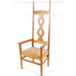 A golden oak throne chair in the manner of C.F.A.