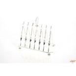 A plated rifle decorated six division toast rack