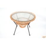 A circular wicker and metalwork occasional table o