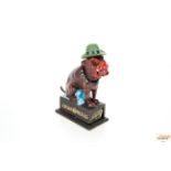 A cast iron novelty money box in the form of a dog