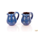 A pair of Branham Pottery puzzle jugs, 10cm