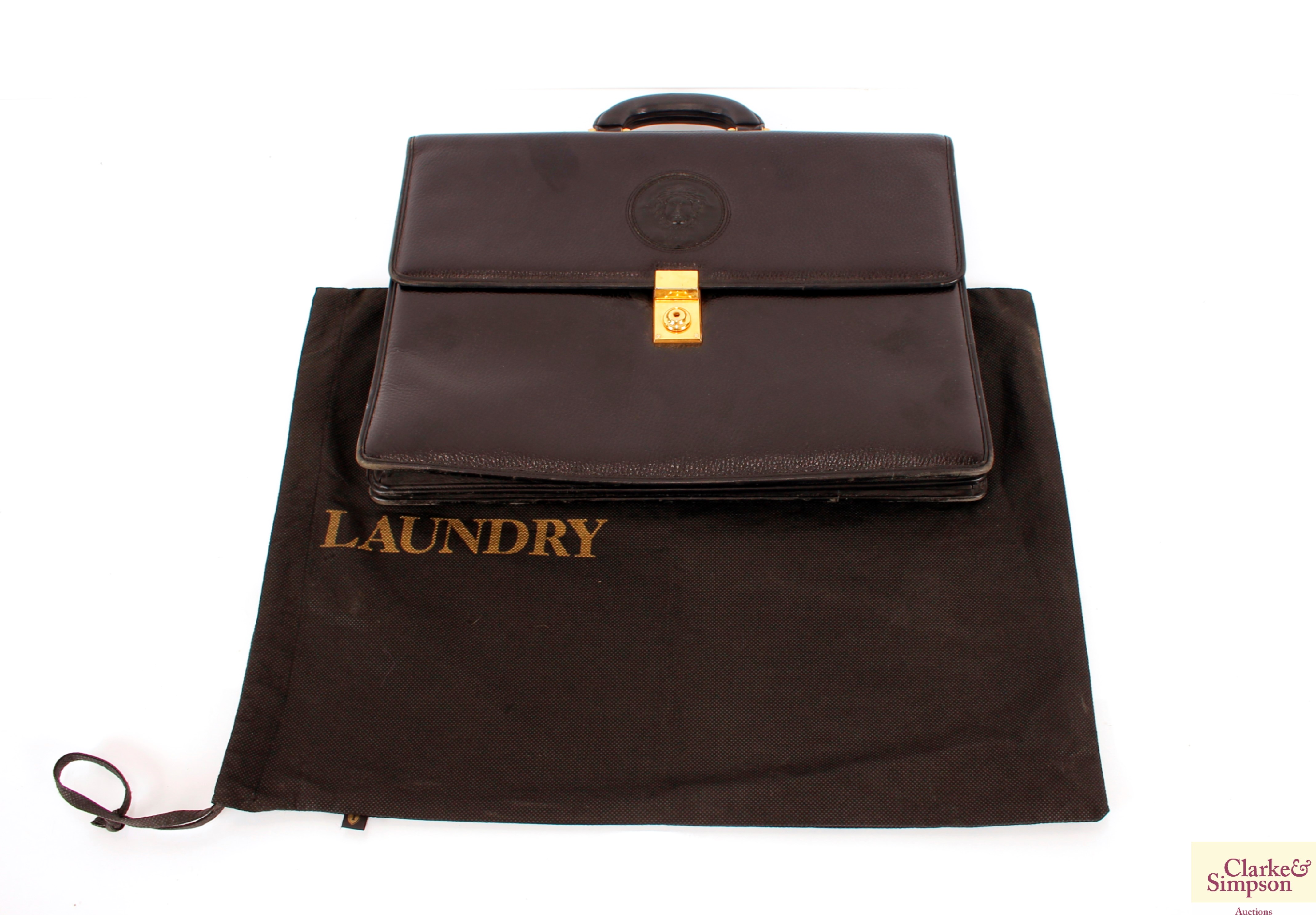 A Versace brief case; and a laundry bag