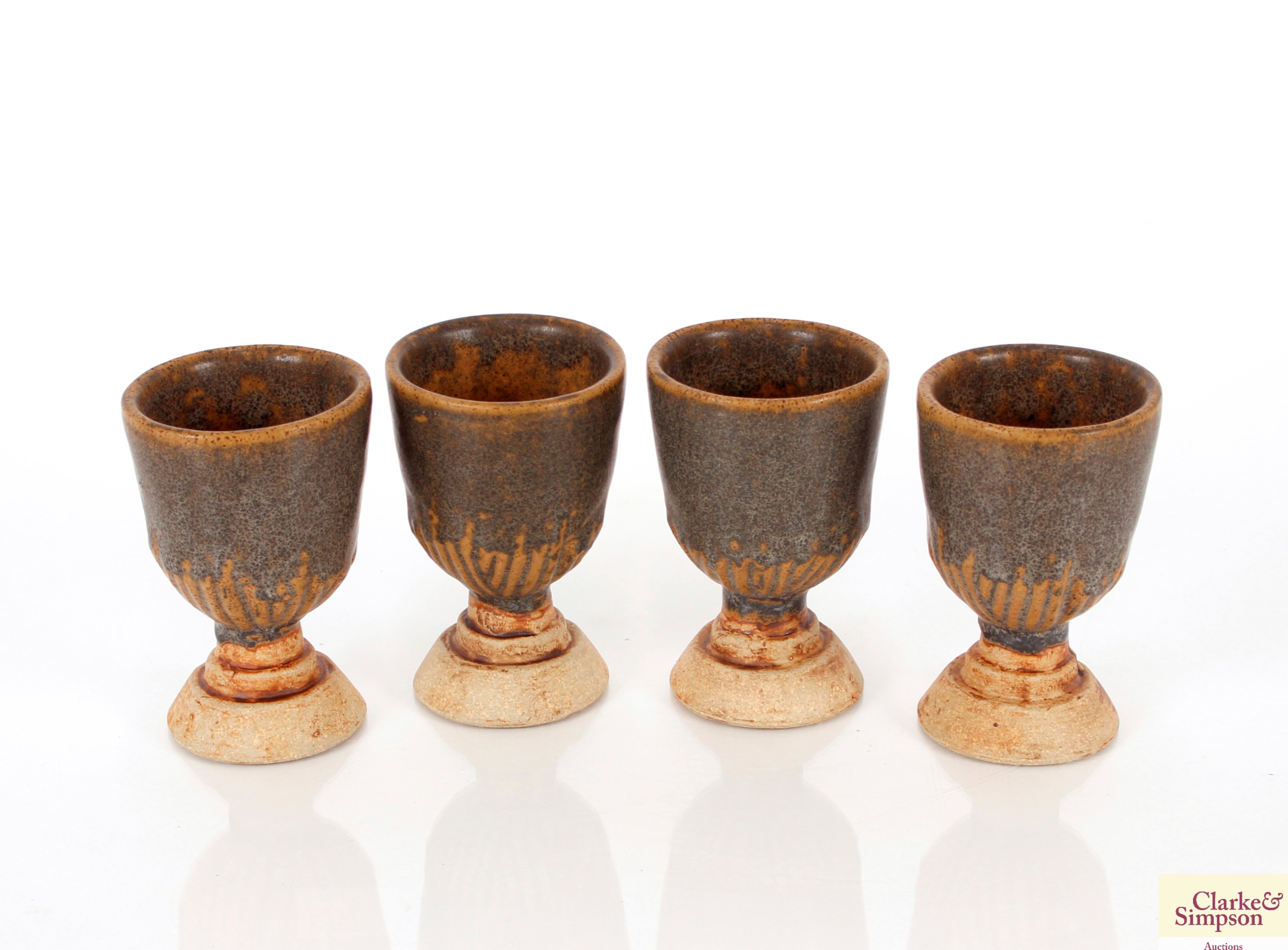 Twelve Studio Pottery goblets; and two baluster St