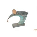 A large bronzed abstract figure group, 80cm long x