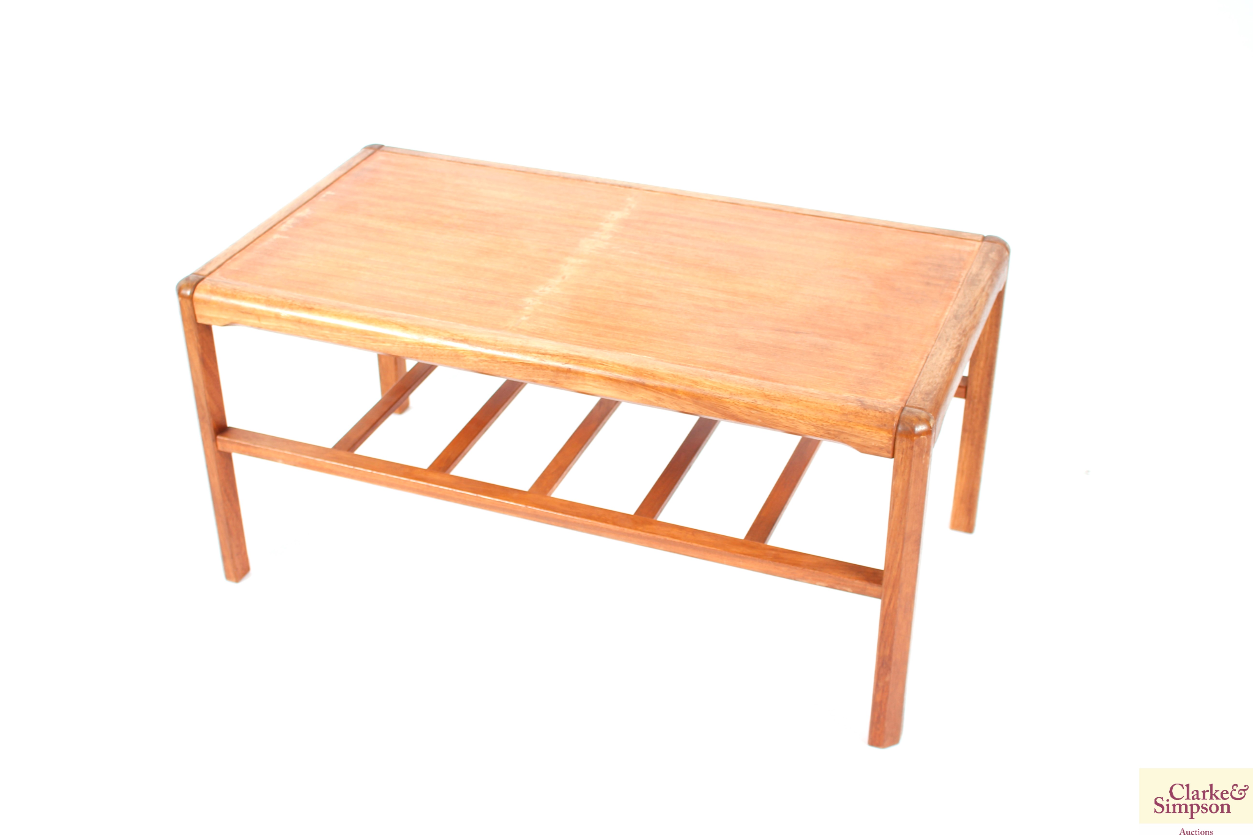 A teak Danish coffee table with under tier, raised