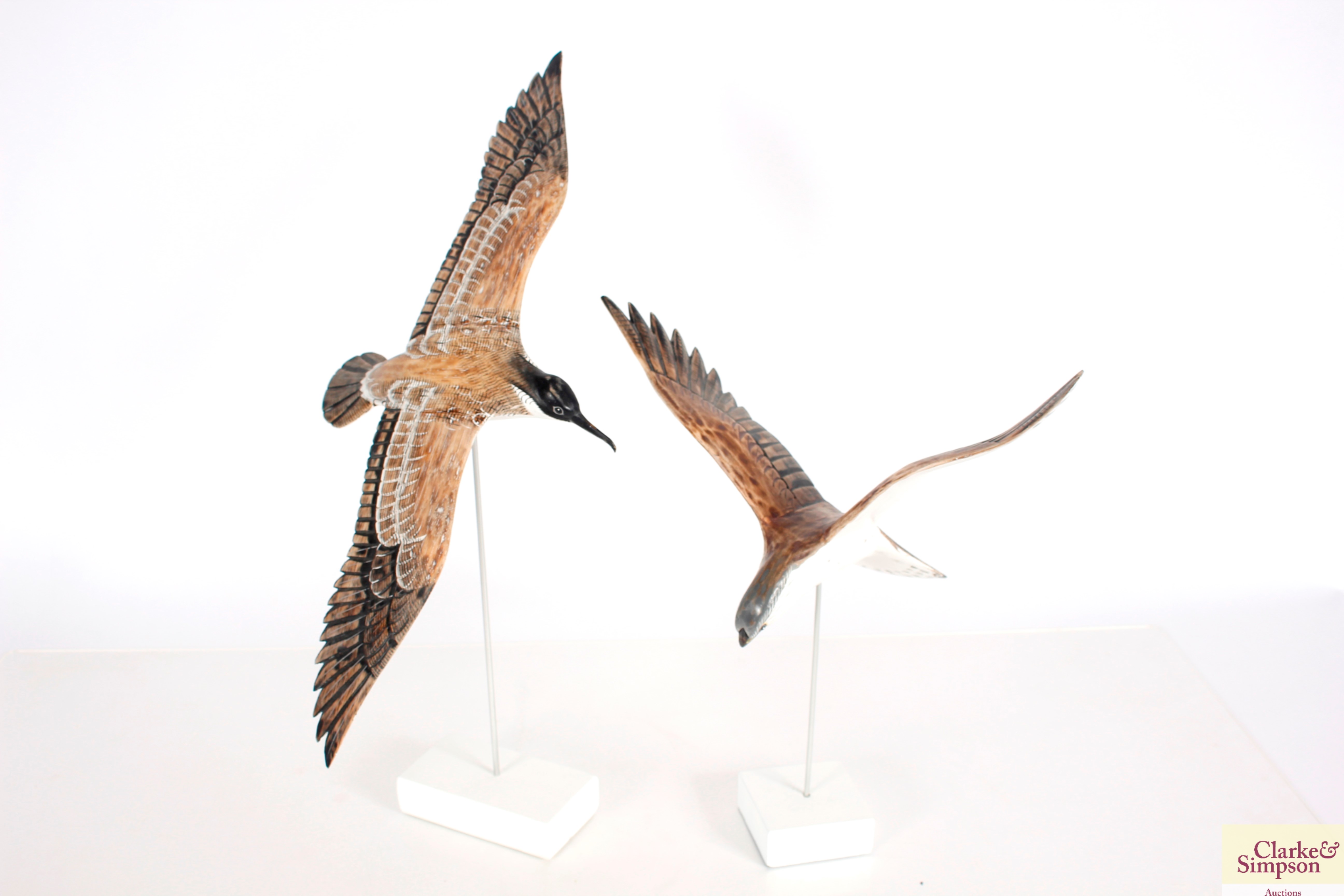 Two painted wooden figures of a seabird and a bird of prey