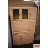 A retro pink and cream, painted kitchen unit, fitt