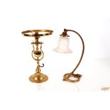 A brass Art Nouveau table lamp with frosted glass