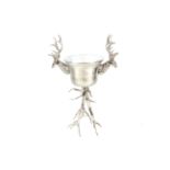 A large plated wine cooler with stags head handles