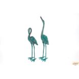 A pair of bronze garden crane ornaments, 105cm hig