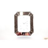 A mirrored mantel clock