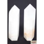 A pair of rock crystal obelisks, 24 cm high